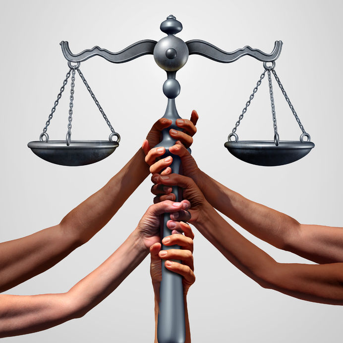 68177085 - social justice concept or class action lawsuit as a group of diverse ethnic people hands holding a court law scale as a metaphor for global equity and equality in society with 3d illustration elements.